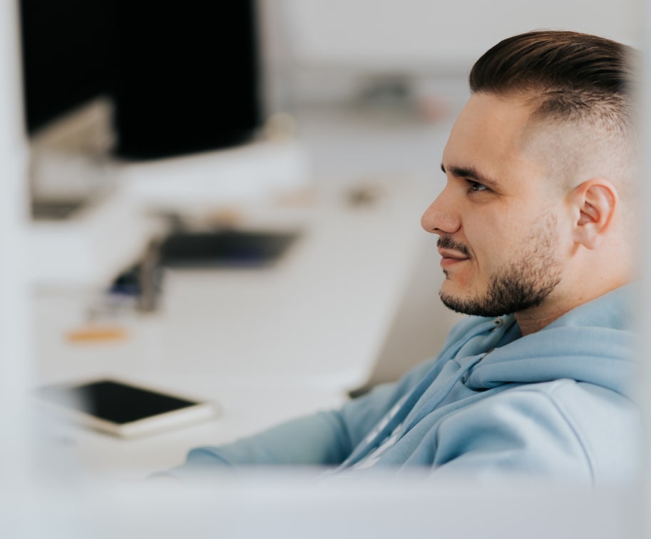 A man sitting at a desk in modern office