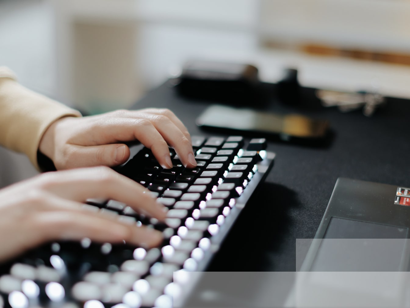 a person is typing on a computer keyboard.